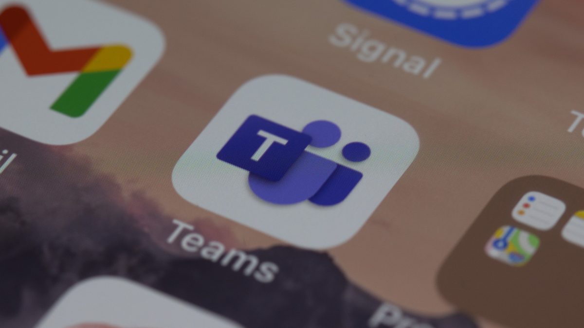 App icons on a mobile display with the Microsoft Teams app being a central focus