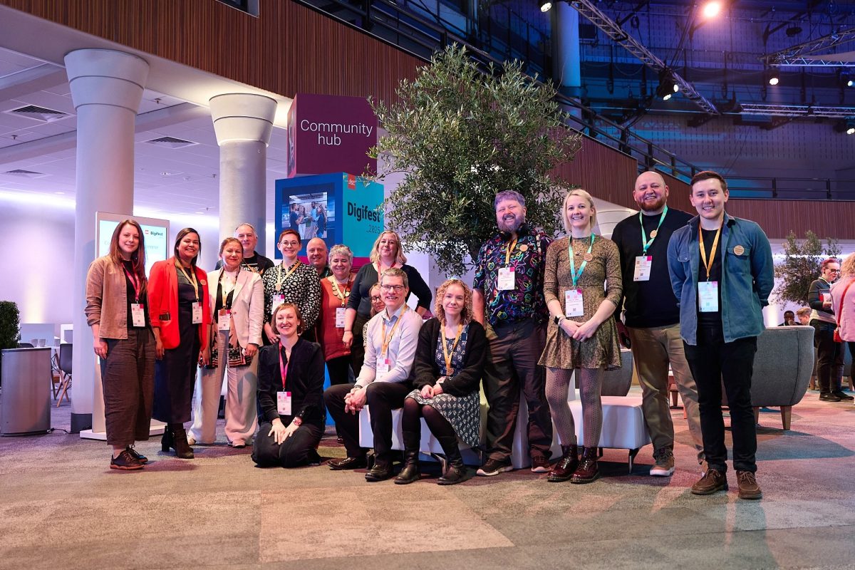 Our 2025 cohort of Community Champions in front of the Community Hub at Digifest.