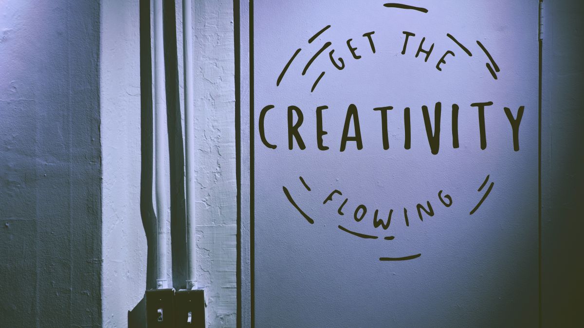 Image of a wall with the quote 'get the creativity flowing'