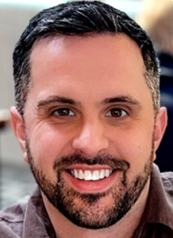Headshot of Patrick Turner, guest author of the post. Man with dark hair and dark beard.